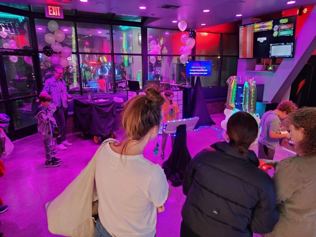 Djs for Kids -Our client guests gathered at Ultrazone Laser tage in Sherman oaks, CA as kids sing karaoke from Mr Dj Services along with Hot Pink lighting