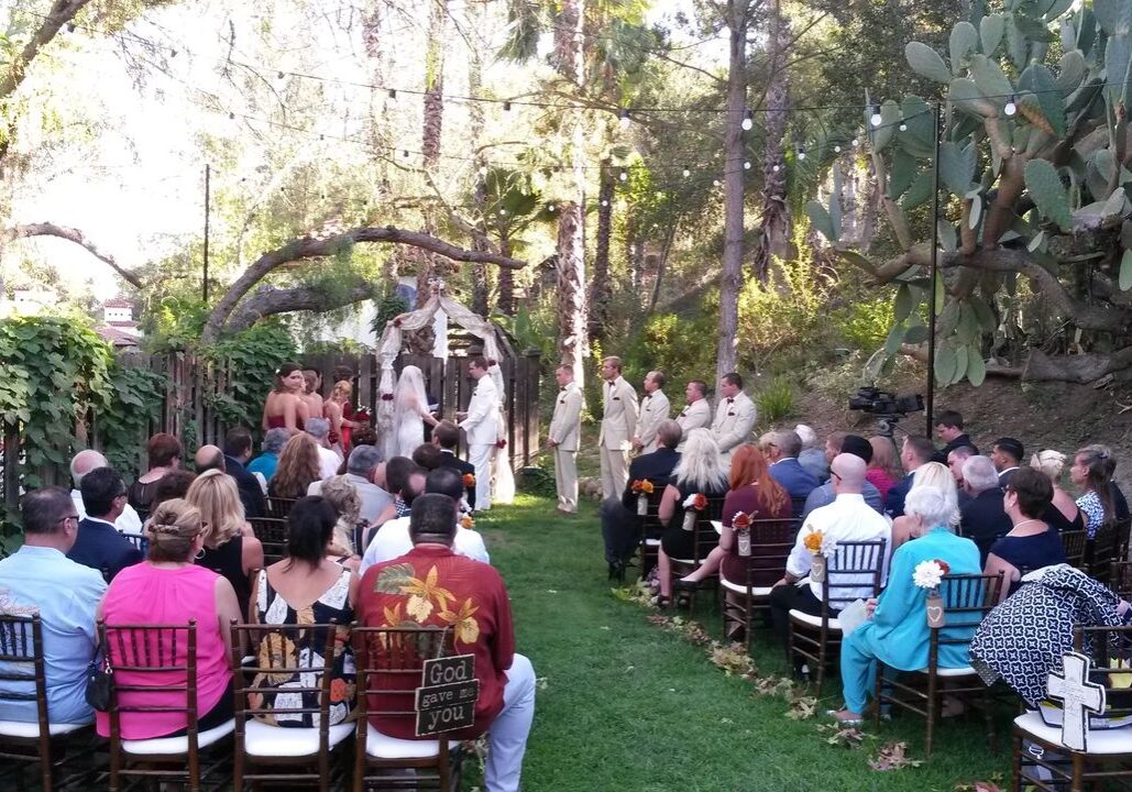 Best Wedding Dj ceremony with bride, groom, bridesmaids and groomsmen, guests seated.