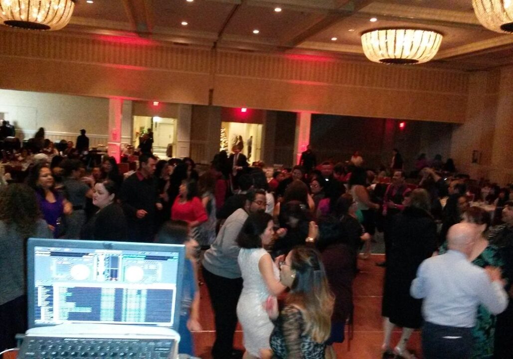 Our Event Dj Services for a 300 plus dance in a ballroom with chandeliers. A DJ, lighting and corporate games.